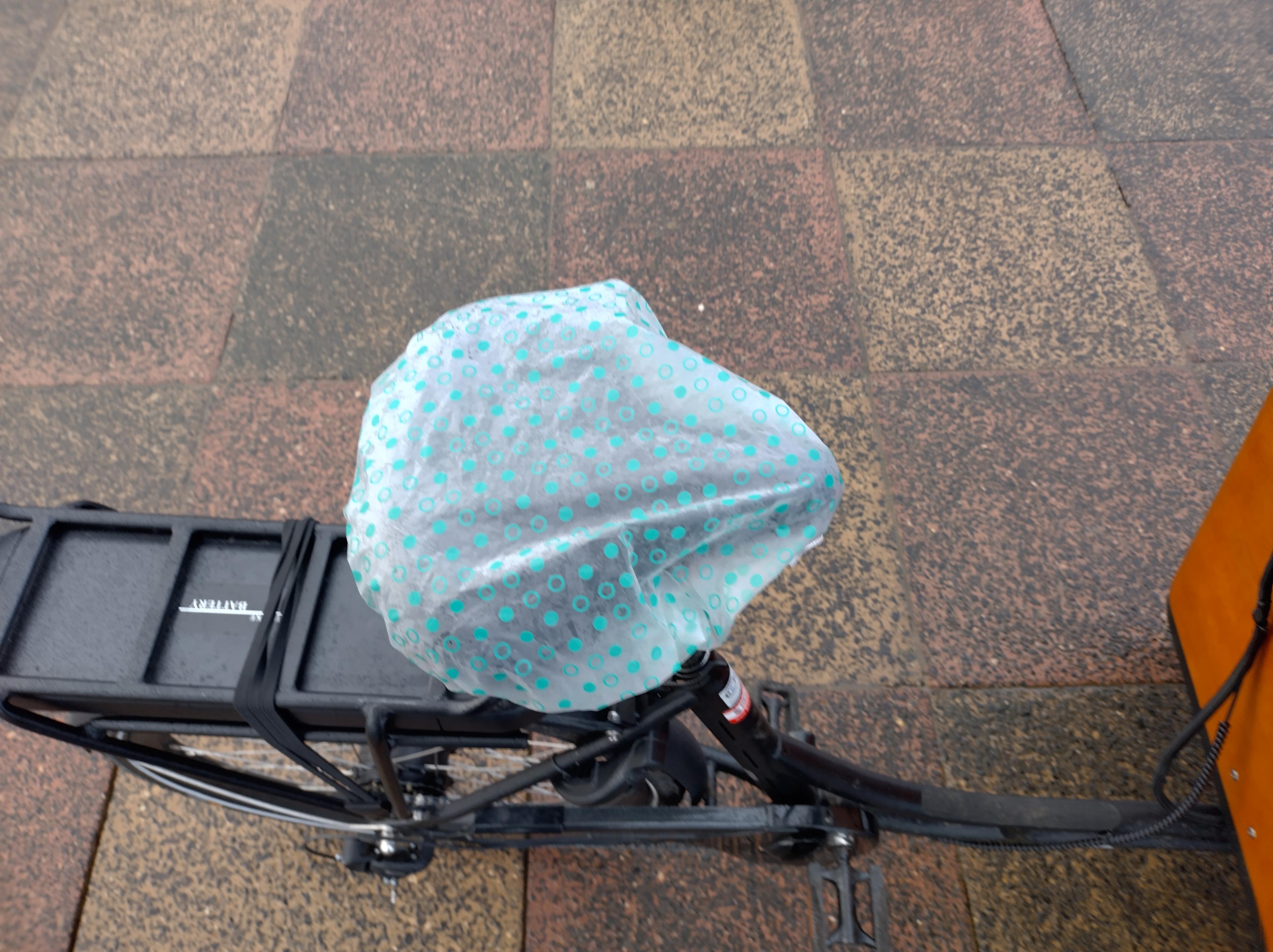 The rider's seat, covered with a shower cap.